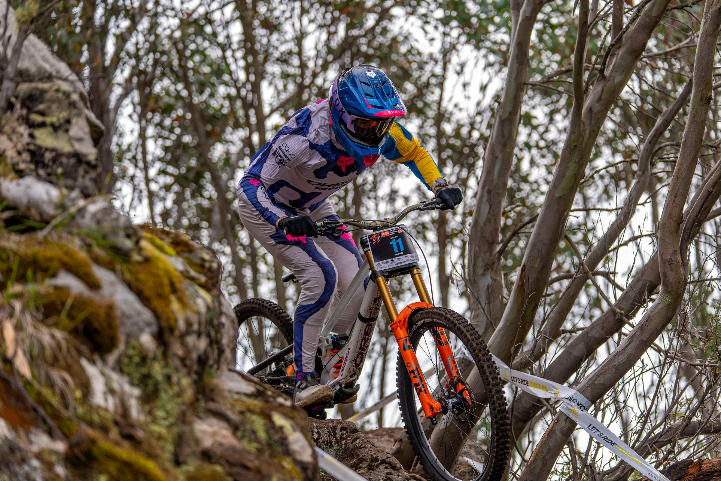 A downhill mountain bike rider races during the Victorian Downhill Series at Falls Creek 2026
